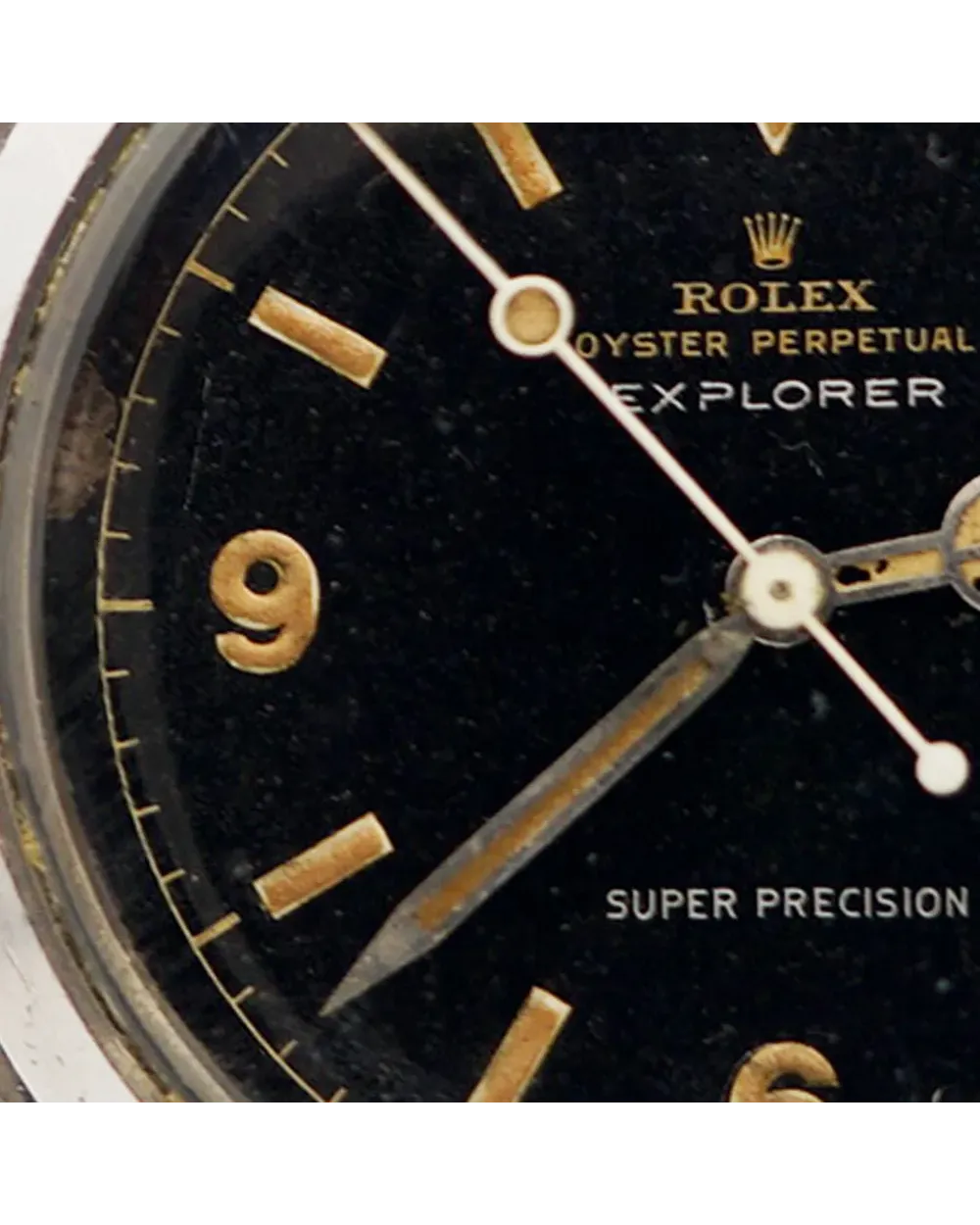 Dial detail of a Rolex Oyster Perpetual Explorer 5504 showing tropical patina on gilt markers and hands.