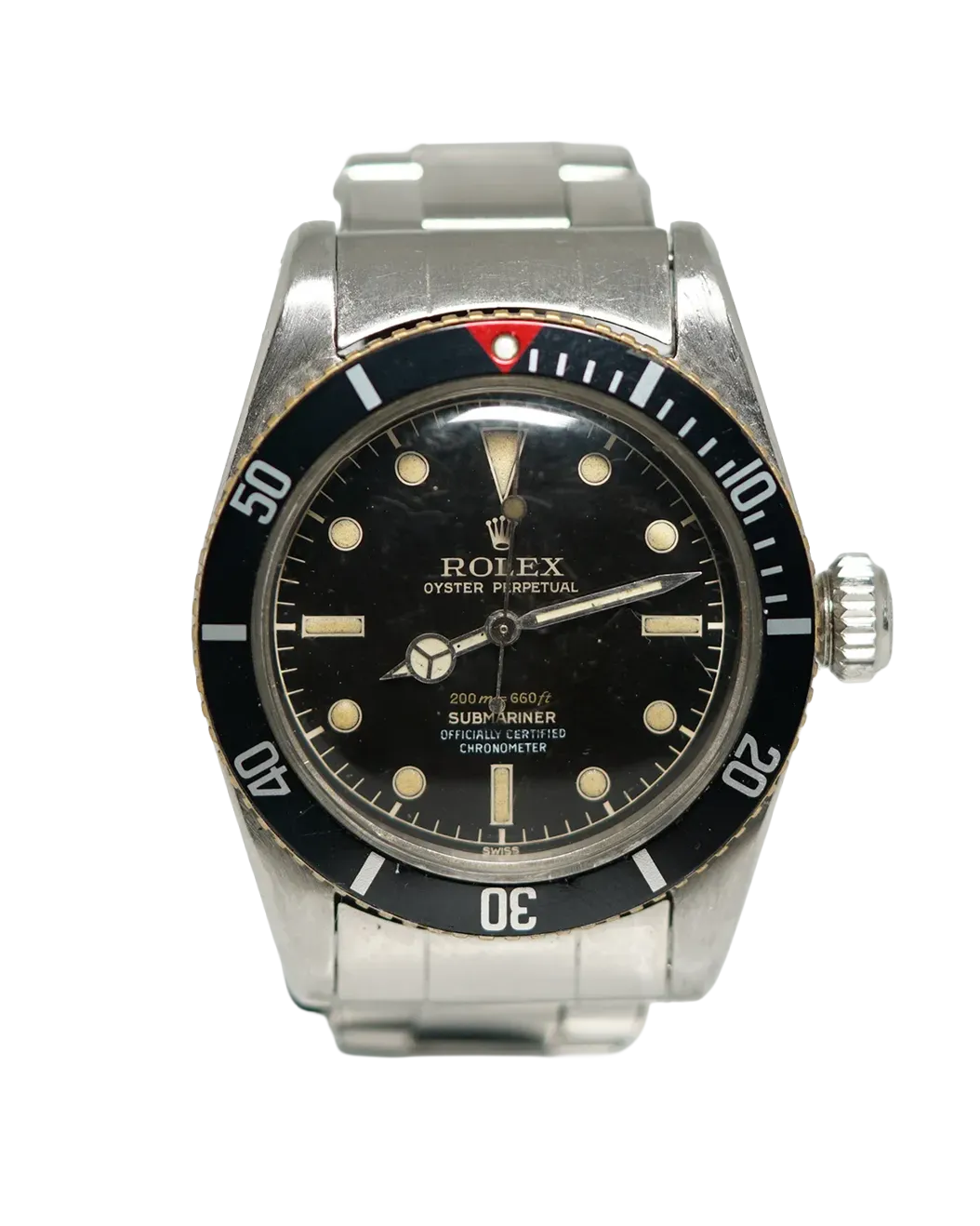 Front-facing shot of a Rolex Submariner 6538 with black gilt dial, cream patina indices, and rotating bezel.