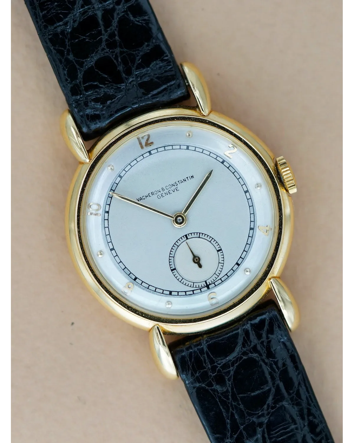 Dial detail of a Vacheron Constantin Genève in yellow gold with white enamel dial and sub-seconds on black crocodile strap.