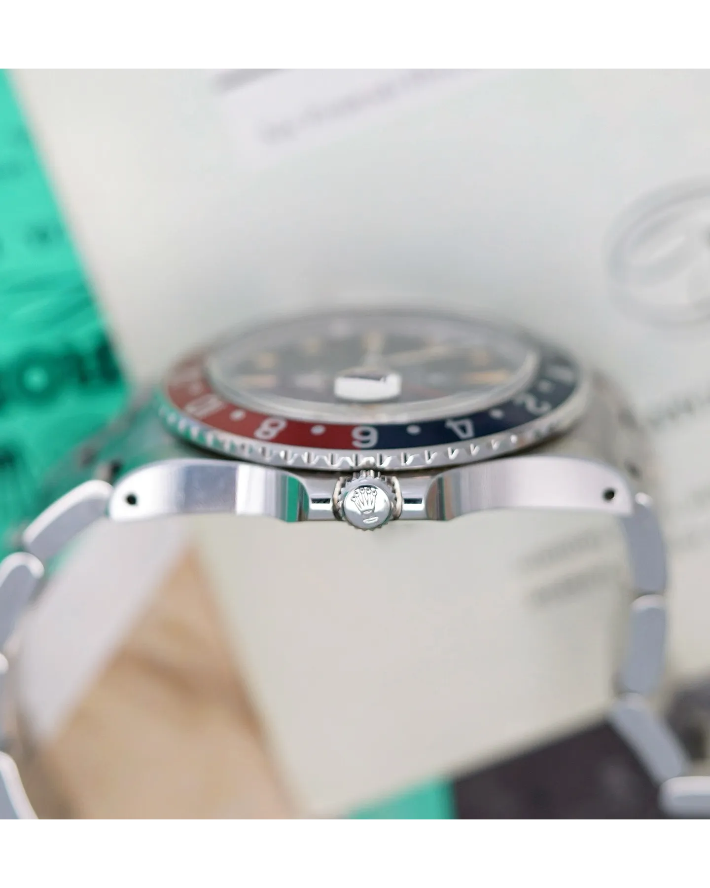 Profile shot of a Rolex GMT-Master with red and blue Pepsi bezel insert on Oyster bracelet.