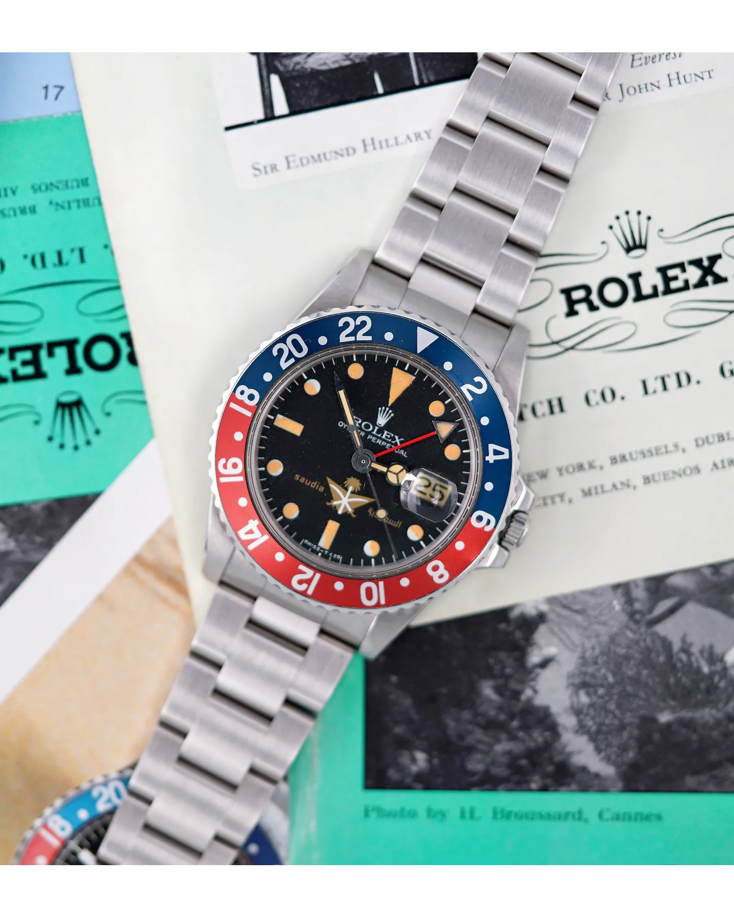 Dial detail of a Rolex GMT-Master with faded tropical dial, Pepsi bezel insert, and patinated luminous plots.