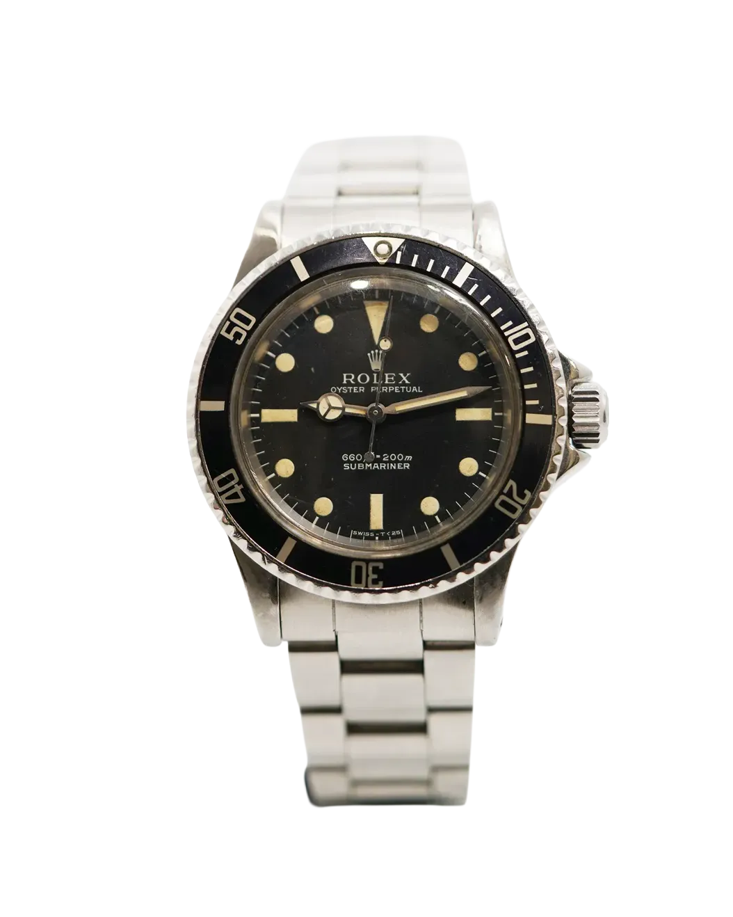 Dial view of a Rolex Submariner 5513 with matte black dial, aged tritium plots, and rotating bezel.